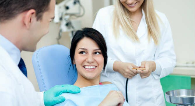 dentist with patient - dallas, tx